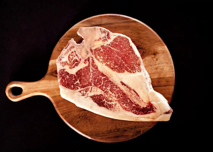 100% All-Natural Grass-Fed Pasture-Raised Wagyu Porterhouse T-BoneCut from the most prized parts of the cow — the filet mignon and the NY strip steak, 100% All-Natural Grass-Fed Pasture-Raised Wagyu Porterhouse T-Bone is sure to im100%The Hufeisen-Ranch (WYO Wagyu)
