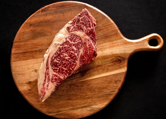 100% All-Natural American Wagyu RibeyeWagyu Ribeye is a highly prized cut of beef known for its exceptional marbling, tenderness, and rich flavor. This steak comes from the rib section of the Wagyu cattl-Natural American Wagyu RibeyeThe Hufeisen-Ranch (WYO Wagyu)