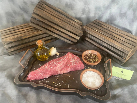 100% All-Natural American Wagyu Tri-TipWagyu Tri-Tip is a tender and flavorful cut of beef that is highly sought after for its marbling and rich taste. This triangular-shaped cut comes from the bottom sir100%The Hufeisen-Ranch (WYO Wagyu)