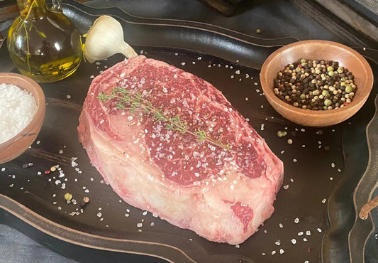 100% All-Natural Grass-fed American Wagyu Bone-In Ribeye SteakIndulge in the unparalleled luxury of our Wagyu Bone-In Ribeye. Carefully selected from the finest Wagyu cattle, this cut showcases the perfect balance of rich marbl100%The Hufeisen-Ranch (WYO Wagyu)