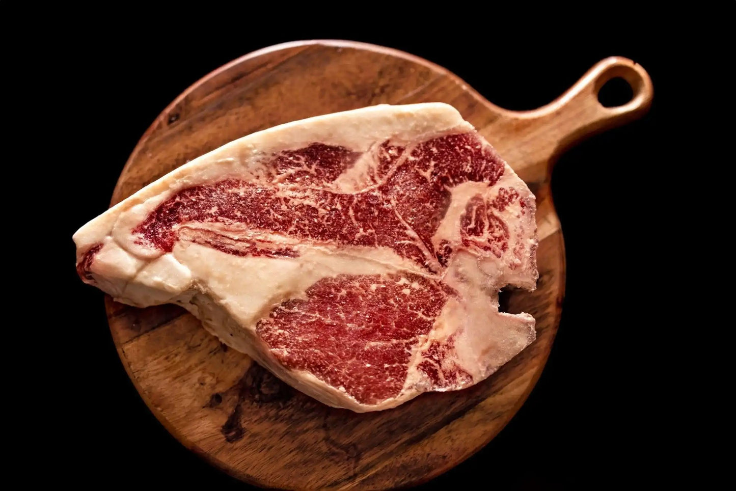 100% All-Natural Grass-Fed Pasture-Raised Wagyu Porterhouse T-BoneCut from the most prized parts of the cow — the filet mignon and the NY strip steak, 100% All-Natural Grass-Fed Pasture-Raised Wagyu Porterhouse T-Bone is sure to im100%The Hufeisen-Ranch (WYO Wagyu)