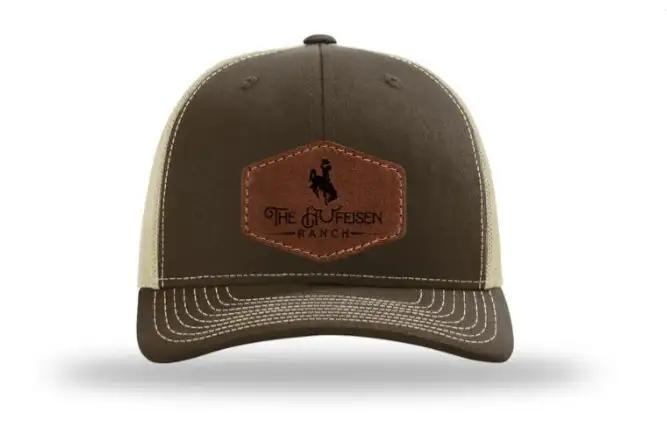 Hufeisen Ranch Throwback Leather Patch HatThank you for supporting our Ranch!! 

Introducing the Richardson 112 Trucker Snapback - The Ultimate Blend of Style and Comfort
Elevate your hat game with the RichaHufeisen Ranch Throwback Leather Patch HatThe Hufeisen-Ranch (WYO Wagyu)